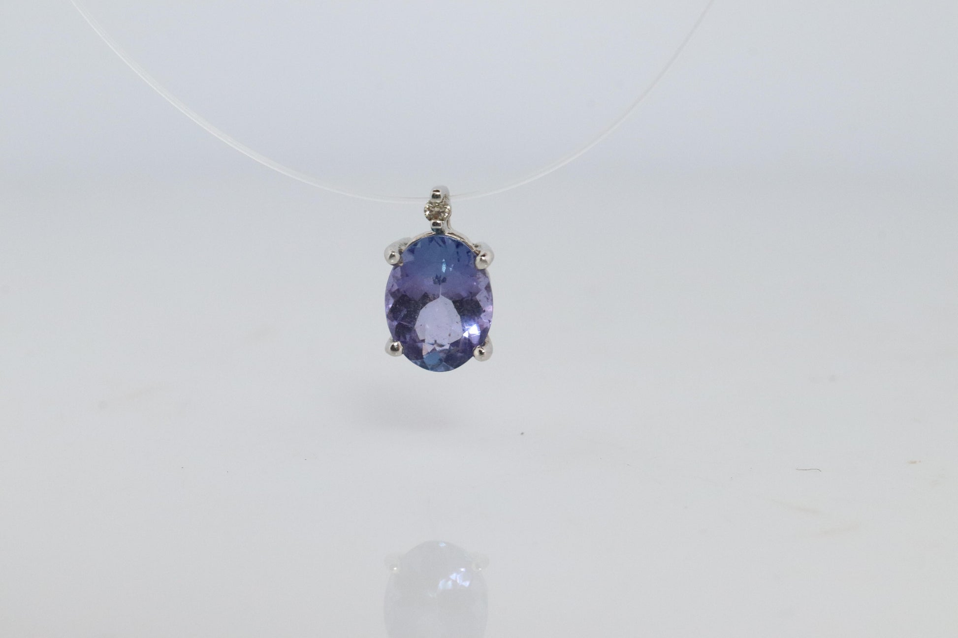 Tanzanite and diamond Pendant. PT850 Platinum Dainty Oval Tanzanite Solitaire
