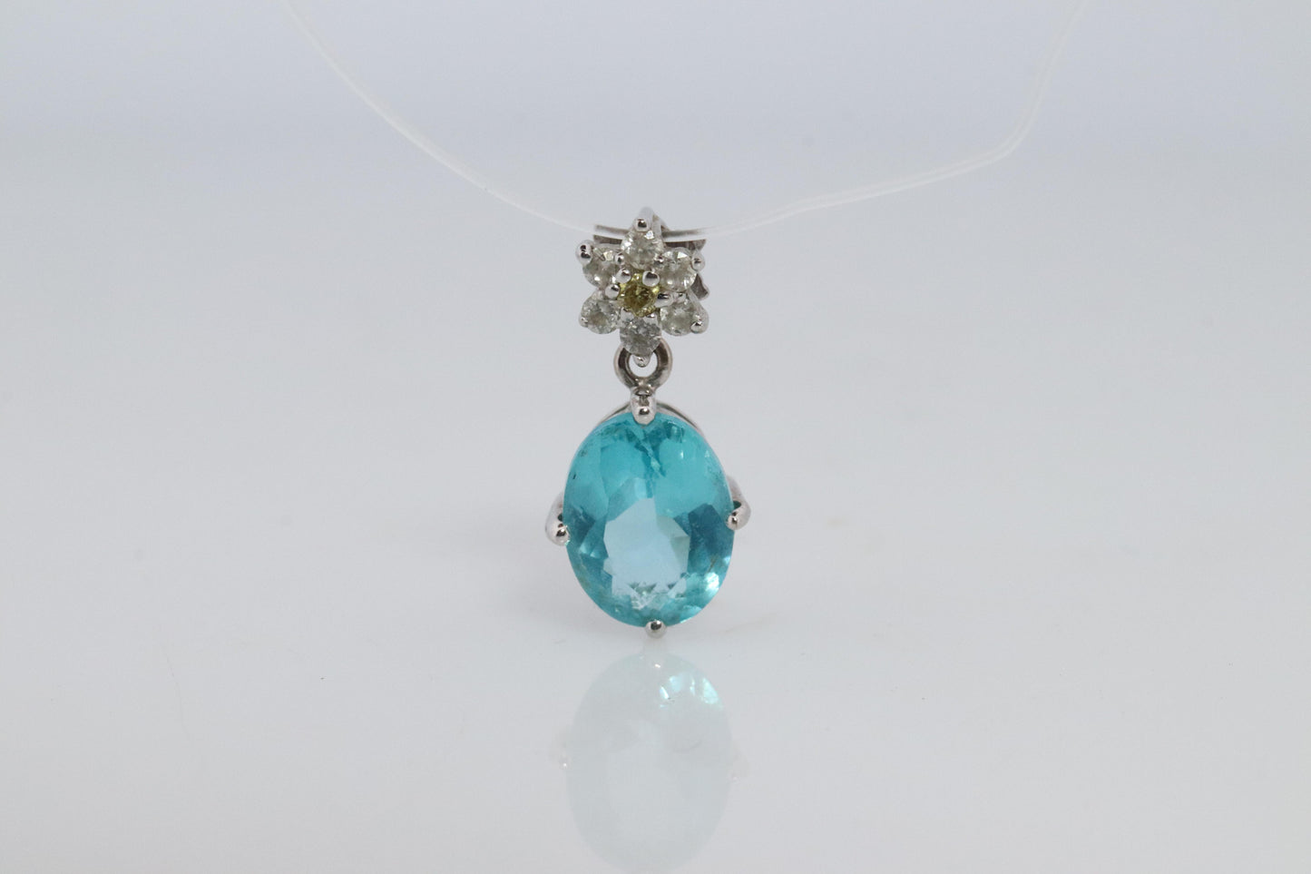 18k Blue TOPAZ Pendant. High quality solitaire oval pendant with Daisy Diamonds.