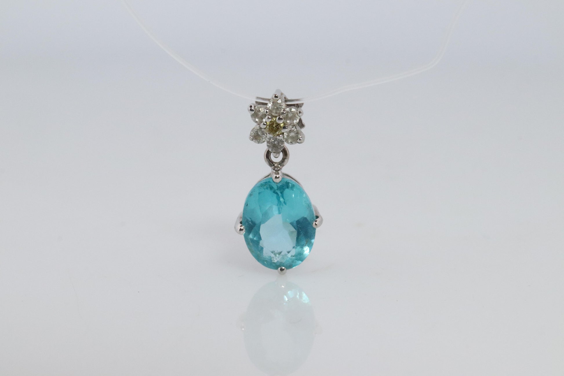 18k Blue TOPAZ Pendant. High quality solitaire oval pendant with Daisy Diamonds.