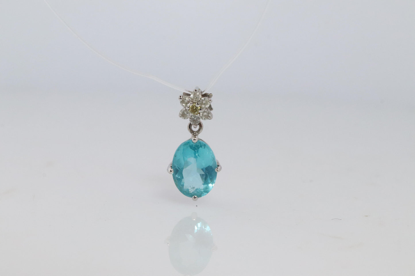 18k Blue TOPAZ Pendant. High quality solitaire oval pendant with Daisy Diamonds.