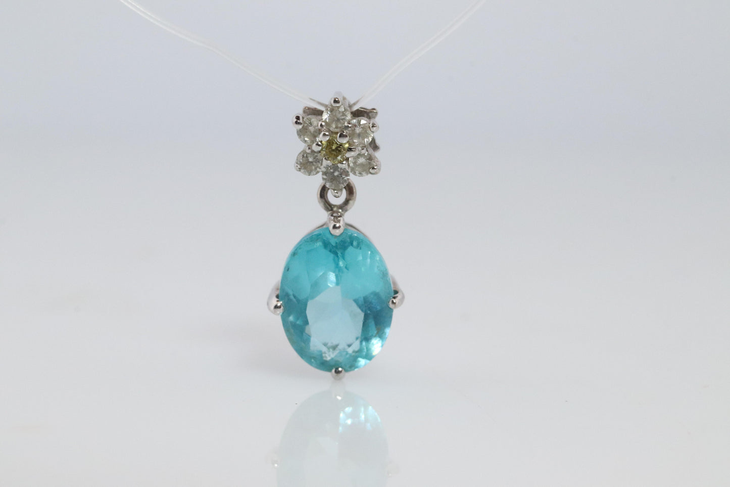 18k Blue TOPAZ Pendant. High quality solitaire oval pendant with Daisy Diamonds.