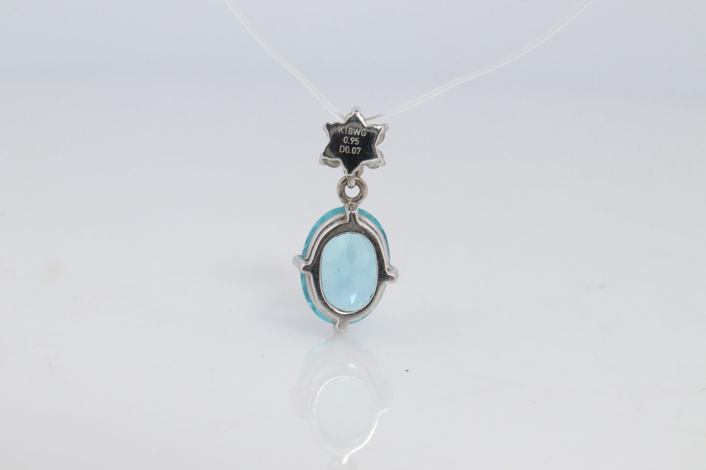 18k Blue TOPAZ Pendant. High quality solitaire oval pendant with Daisy Diamonds.