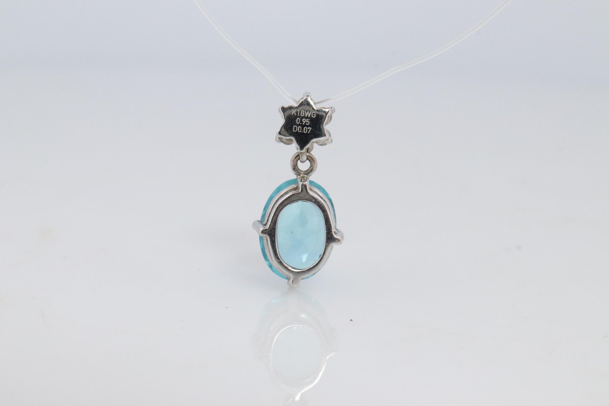 18k Blue TOPAZ Pendant. High quality solitaire oval pendant with Daisy Diamonds.