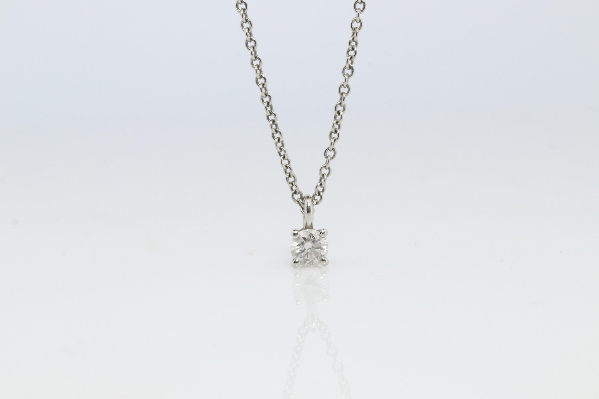 Tiffany Co Diamond Solitaire Necklace. Platinum 0.15ct Diamond Pendant.