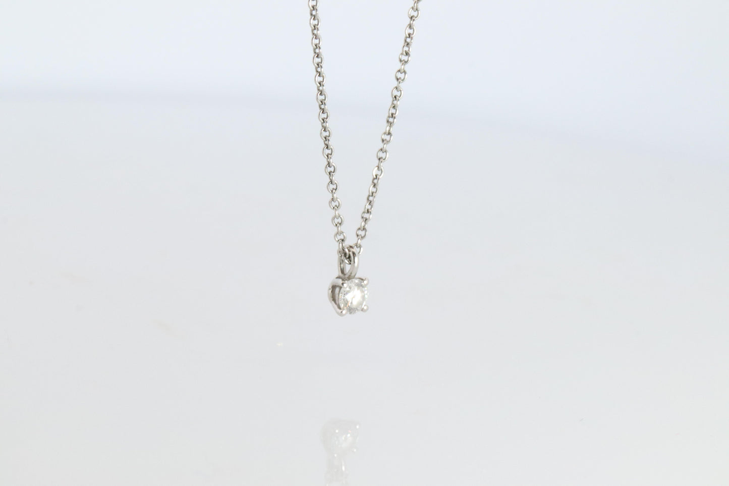 Tiffany Co Diamond Solitaire Necklace. Platinum 0.15ct Diamond Pendant.
