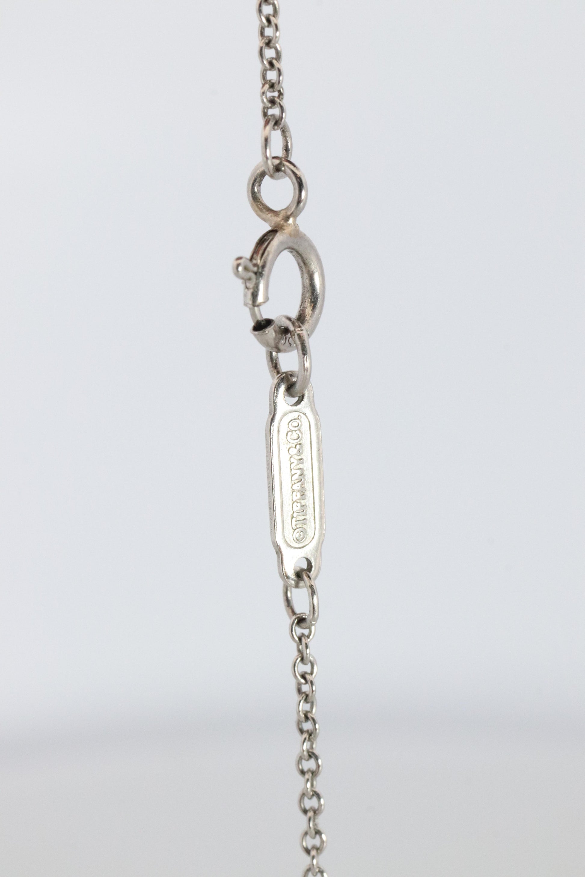 Tiffany Co Diamond Solitaire Necklace. Platinum 0.15ct Diamond Pendant.