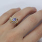 Tanzanite and diamond Cluster ring. 14k Blue Tanzanite and Diamond Halo Bypass