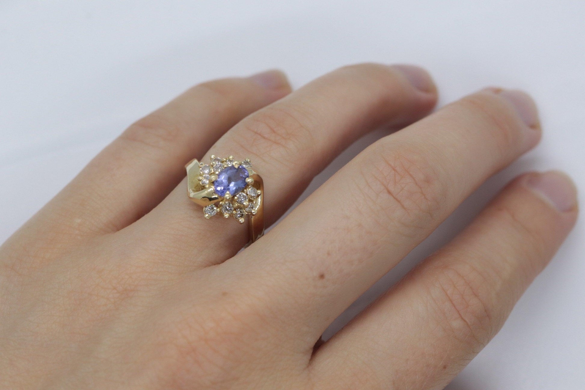 Tanzanite and diamond Cluster ring. 14k Blue Tanzanite and Diamond Halo Bypass
