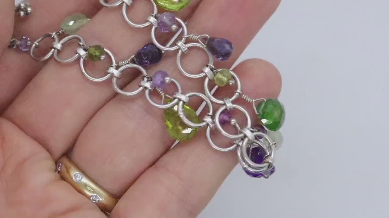 Laura Gibson Bracelet. Sterling Silver with Dangling Faceted Gems - Amethyst (464)