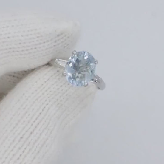 Platinum Large Aquamarine and Tapered Baguette diamond ring. Platinum oval aquamarine engagement ring st632/50