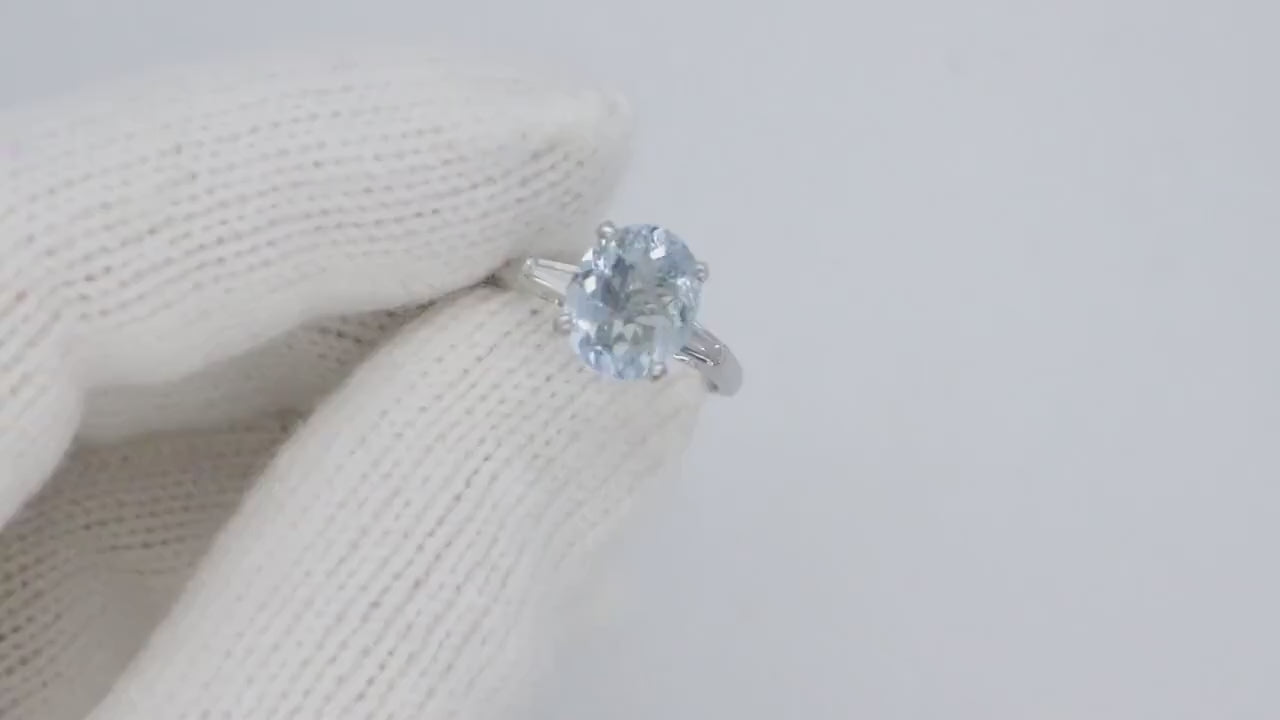 Platinum Large Aquamarine and Tapered Baguette diamond ring. Platinum oval aquamarine engagement ring st632/50