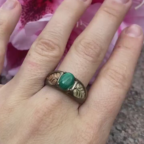 Black Hills Gold Sterling Silver Ring. Green Malachite cabochon with 10k gold inlays band.