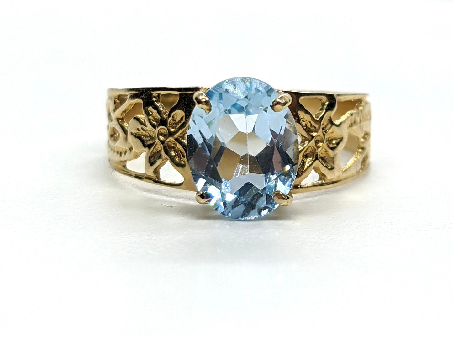 Oval Aquamarine Topaz Solitaire. 10k Filigree ring.