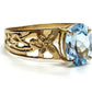 Oval Aquamarine Topaz Solitaire. 10k Filigree ring.