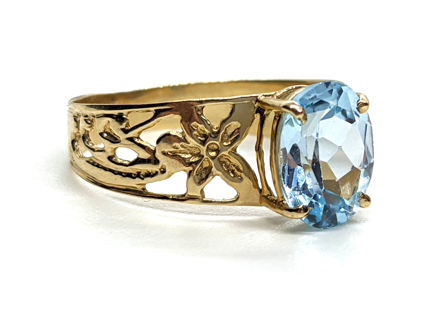 Oval Aquamarine Topaz Solitaire. 10k Filigree ring.