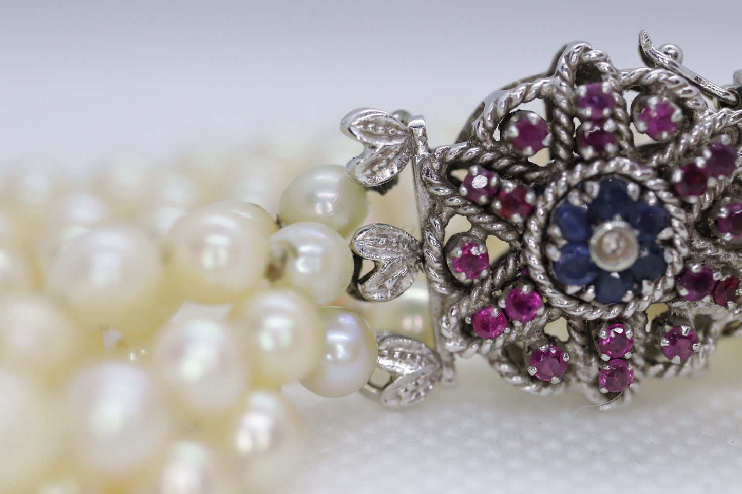 18k Sapphire Ruby Diamond Graduated Saltwater Pearl triple thread necklace.