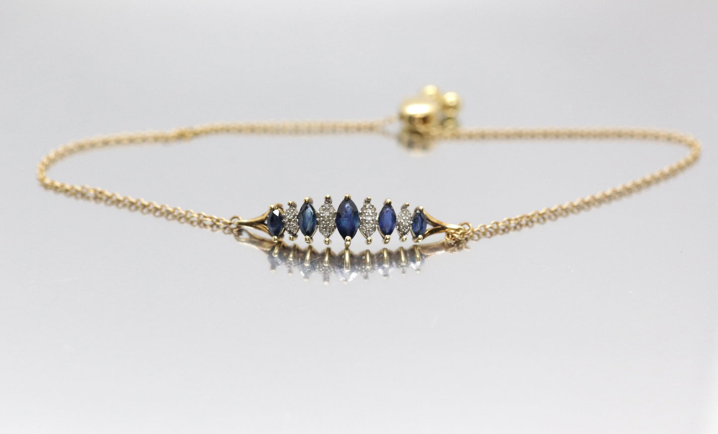 10k London Blue Topaz and Dimond Bracelet. Adjustable 10k SUN Marquise Blue Gem bracelet