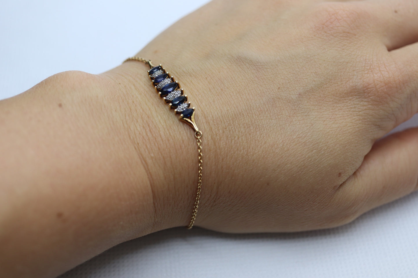 10k London Blue Topaz and Dimond Bracelet. Adjustable 10k SUN Marquise Blue Gem bracelet