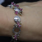 Laura Gibson Bracelet. Sterling Silver with Dangling Faceted Gems -Pink Tourmaline, Smokey Quartz, and Whiskey Quartz (289)