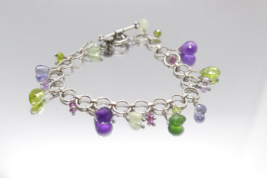 Laura Gibson Bracelet. Sterling Silver with Dangling Faceted Gems - Amethyst (464)