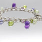 Laura Gibson Bracelet. Sterling Silver with Dangling Faceted Gems - Amethyst (464)