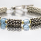 Laura Gibson Bracelet. Sterling Silver and 18k Beads with Dangling Faceted Gems - Topaz -  (584)