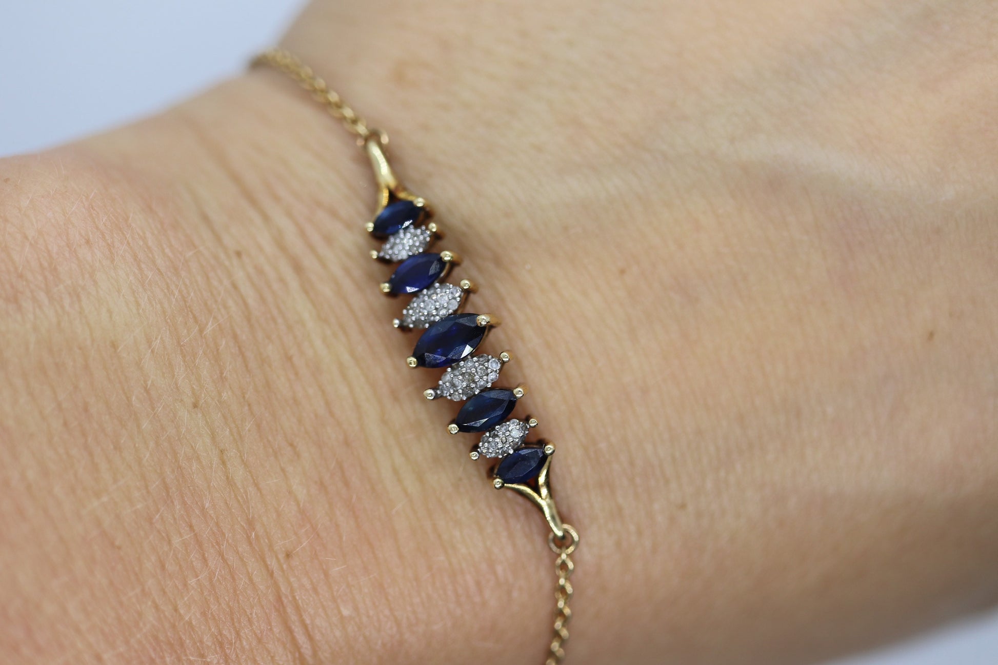 10k London Blue Topaz and Dimond Bracelet. Adjustable 10k SUN Marquise Blue Gem bracelet