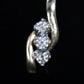 14k Diamond Earrings. 3 stone DIAMOND bypass drop earrings