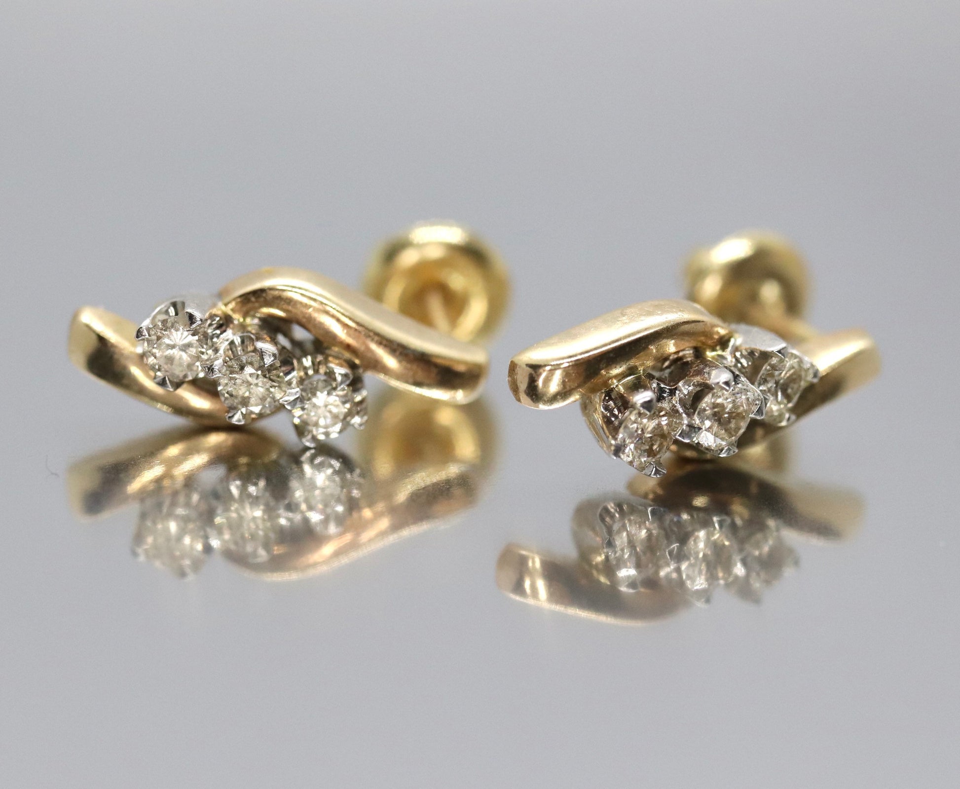 14k Diamond Earrings. 3 stone DIAMOND bypass drop earrings