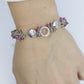 Laura Gibson Bracelet. Sterling Silver with Dangling Faceted Gems -Pink Tourmaline, Smokey Quartz, and Whiskey Quartz (289)