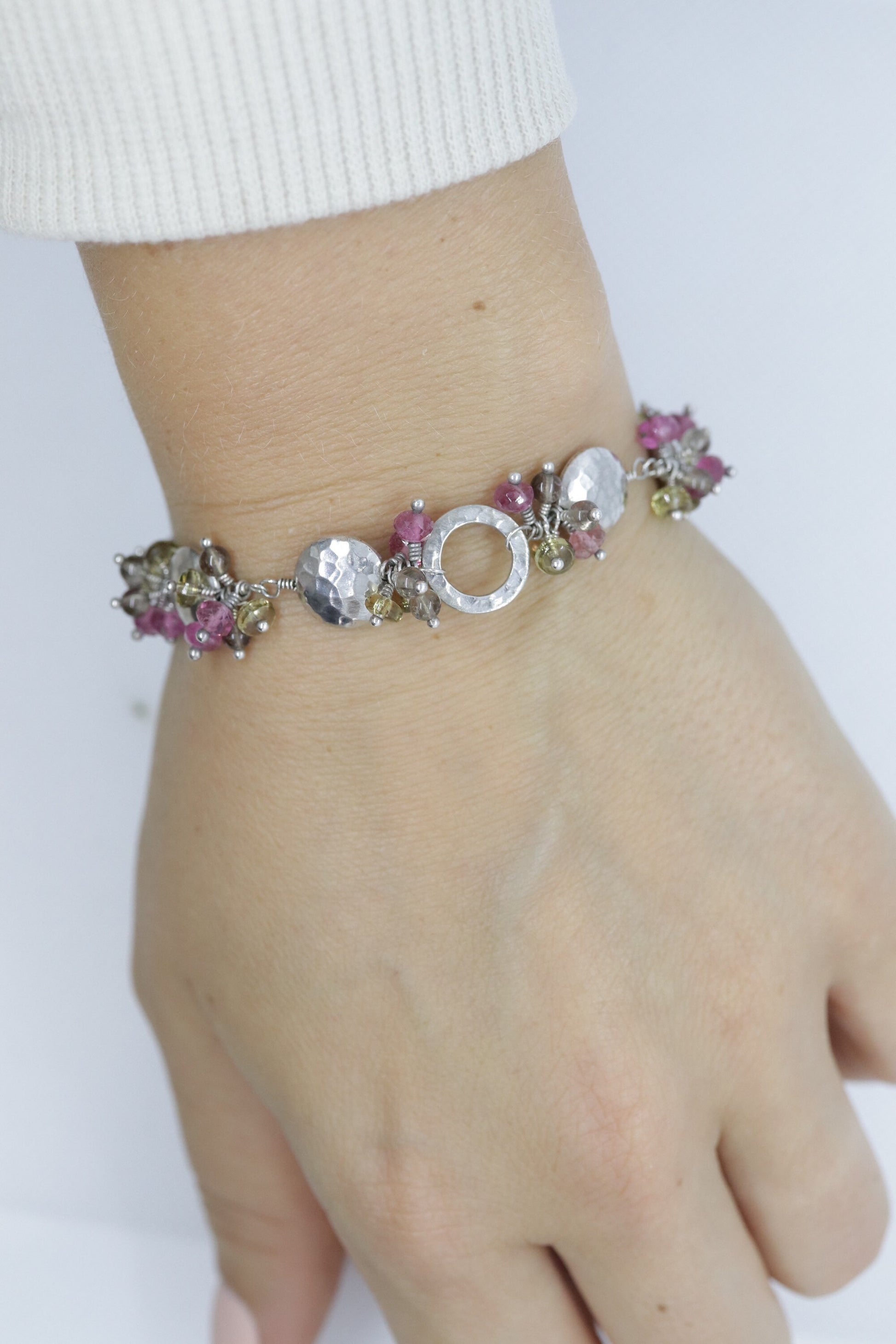 Laura Gibson Bracelet. Sterling Silver with Dangling Faceted Gems -Pink Tourmaline, Smokey Quartz, and Whiskey Quartz (289)