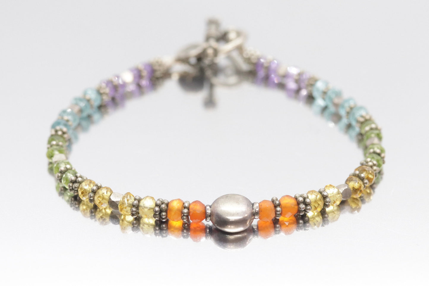 Laura Gibson Bracelet. Sterling Silver with Dangling Faceted Gems - (298)