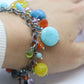 Laura Gibson Bracelet. Sterling Silver with Dangling Faceted Gems - Amazonite Amethyst(435)
