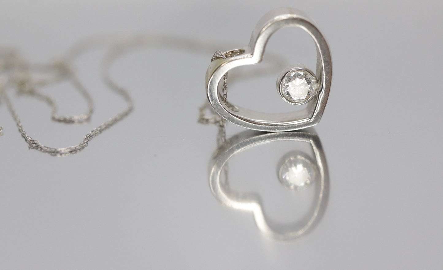 18k Open Heart 0.21ct Diamond Solitaire pendant. 14k 20in thin necklace. Bezel Diamond pendant