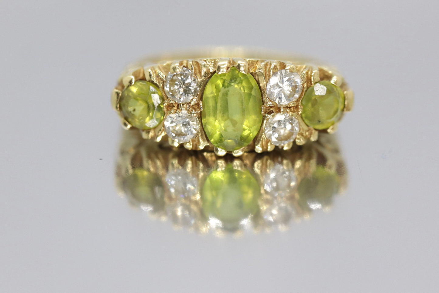 18k Large Peridot and Diamond Ring. Made in UK 1976. 6.4grams with 0.40ctw in diamonds