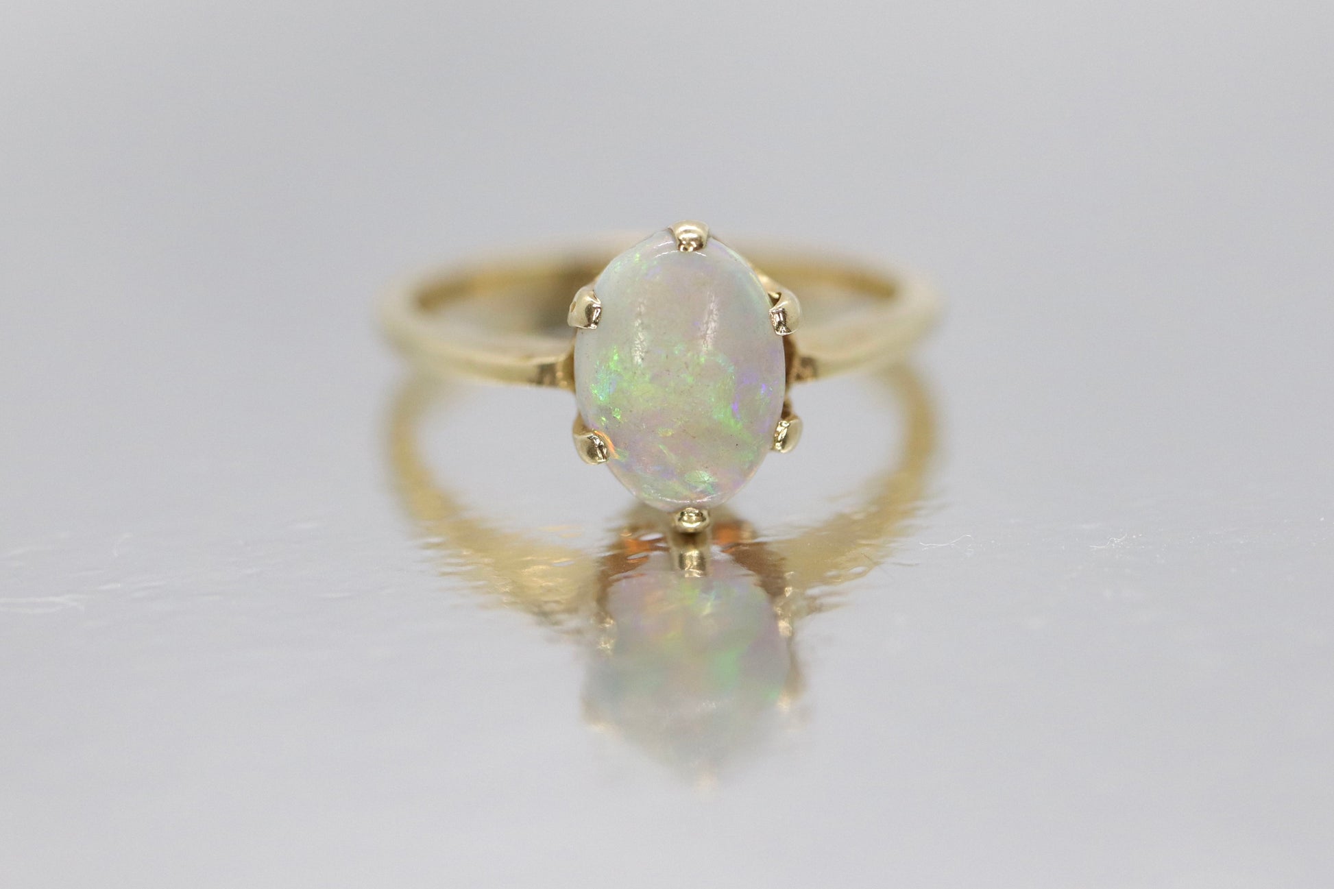 14k Opal Solitaire Claw set ring. Crystal Opal solitaire band.