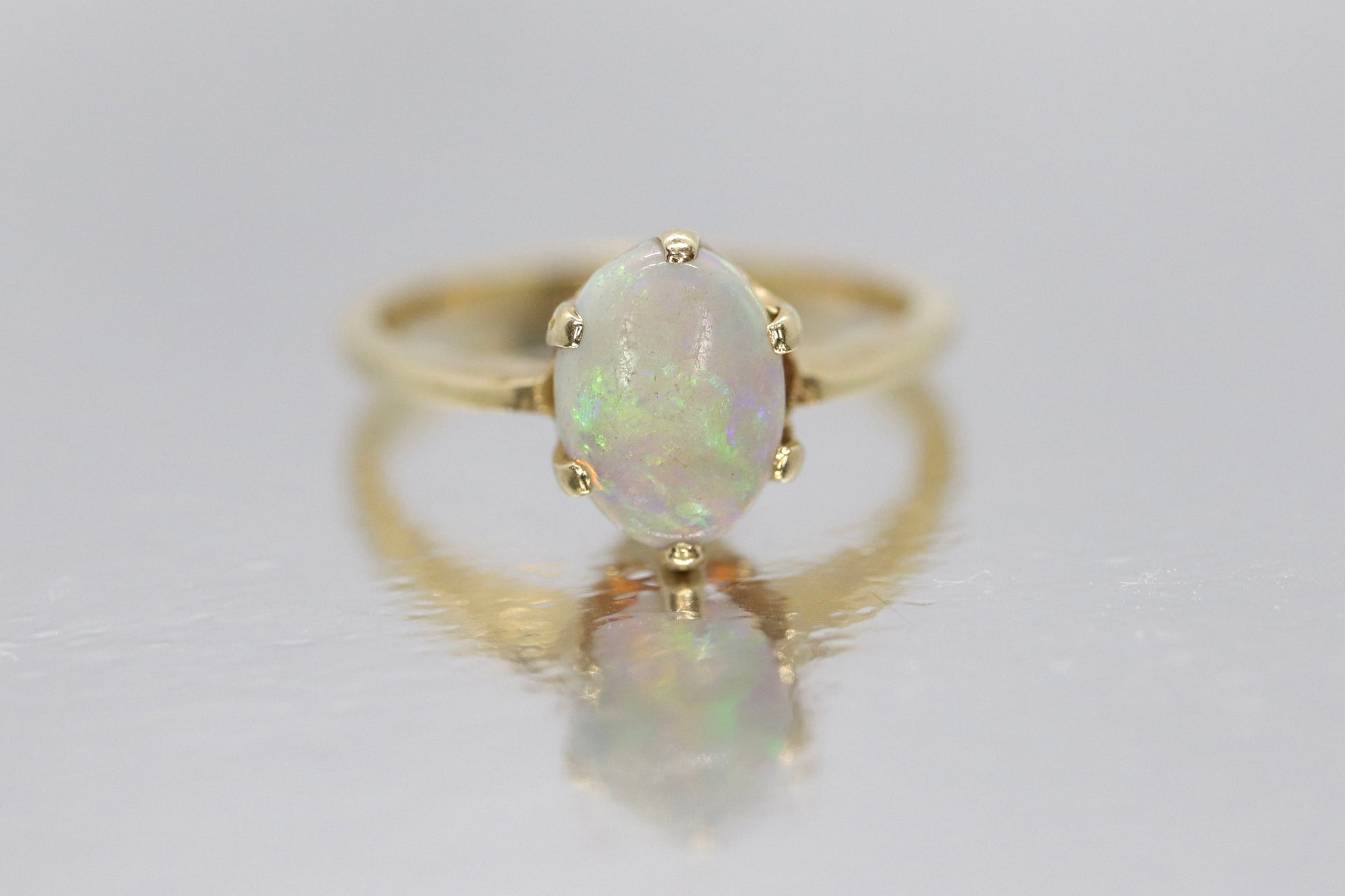 14k Opal Solitaire Claw set ring. Crystal Opal solitaire band.