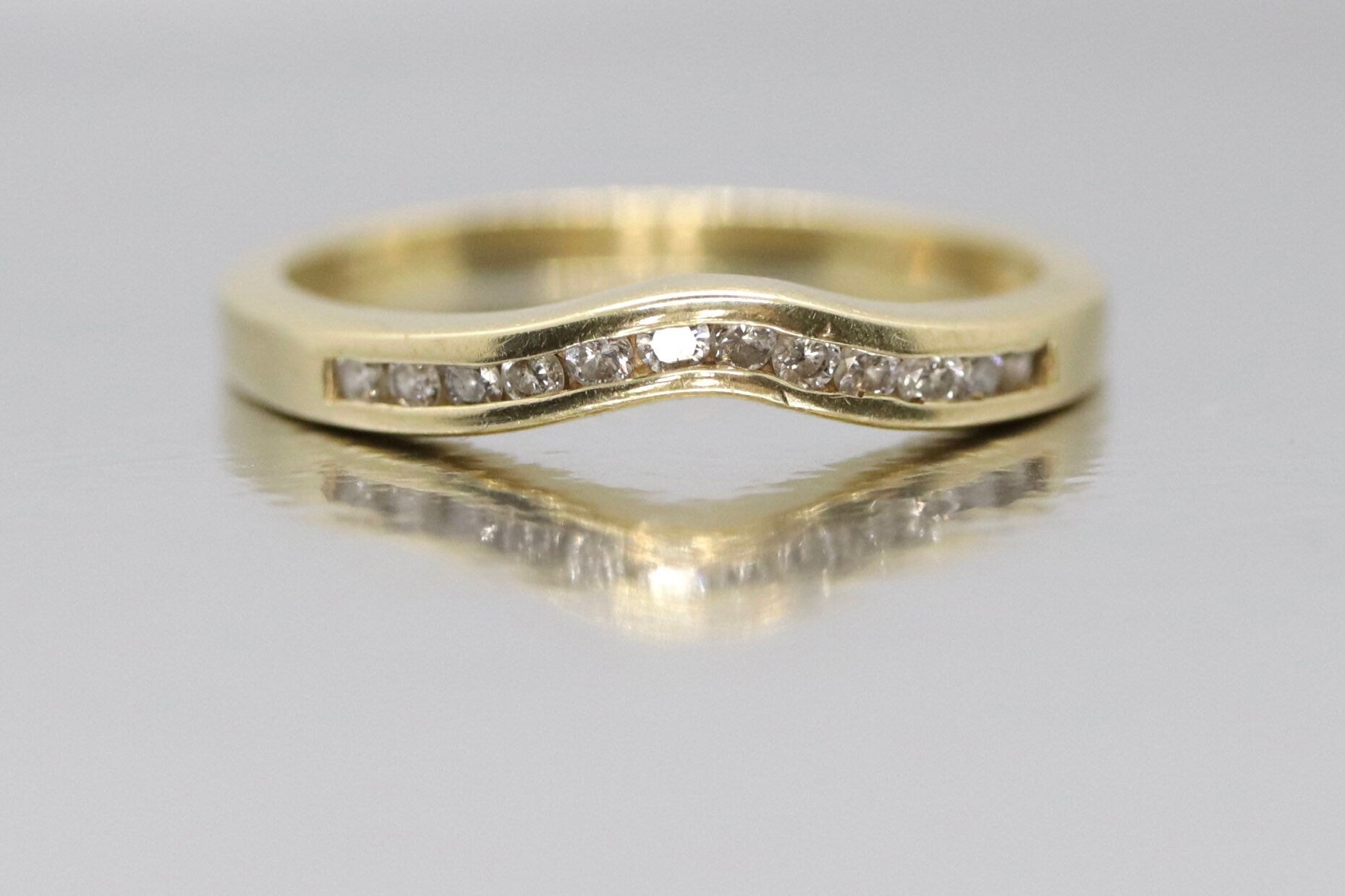 14k Diamond Eternity ring. Channel set Diamond V band