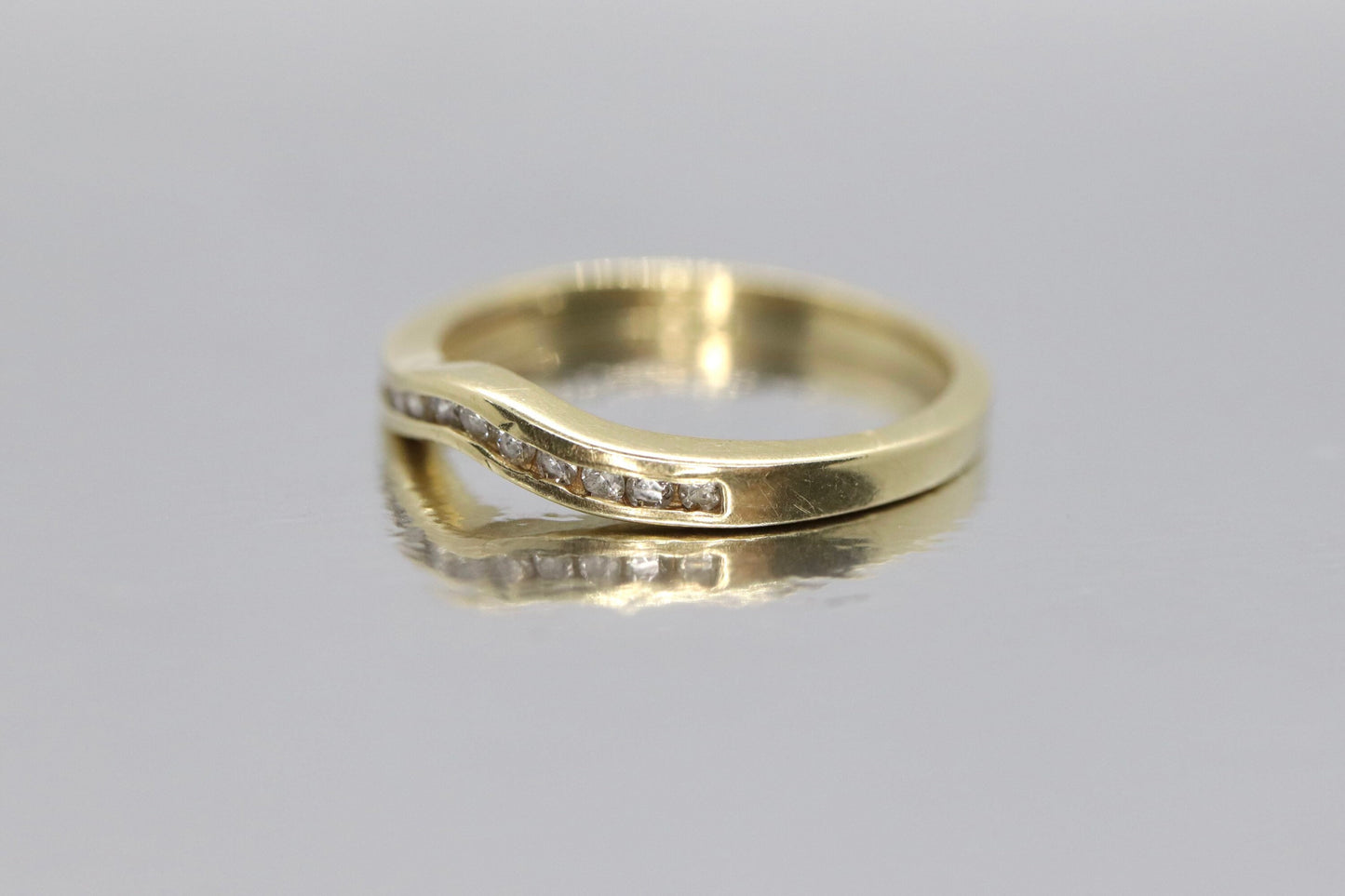 14k Diamond Eternity ring. Channel set Diamond V band