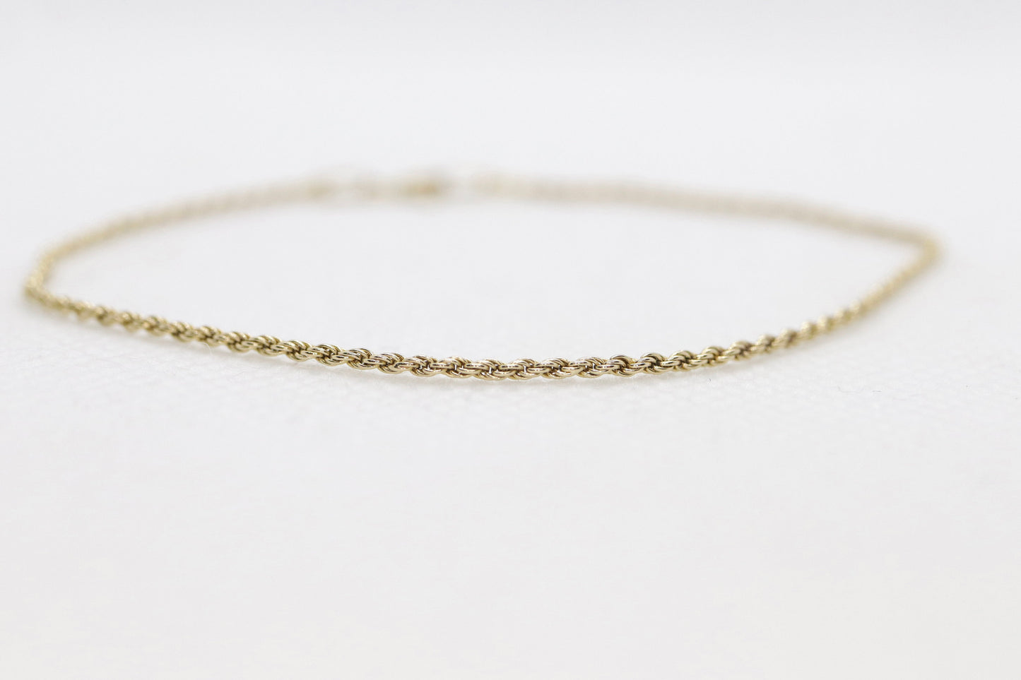 14k Gold Twisted Rope Bracelet 1.3mm 1.3 grams. Gold braided rope bracelet