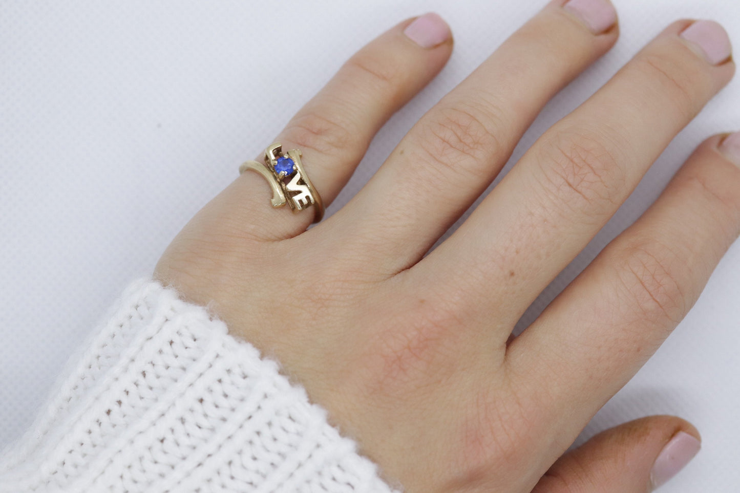 10k LOVE ring. 10k Yellow Gold with round Blue Spinel Solitaire Ring