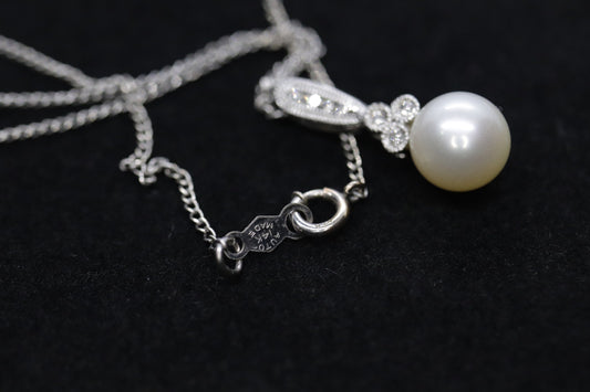 Pearl diamond pendant and necklace. 10k Dangle Pearl pendant with cable necklace (14)(00.90)