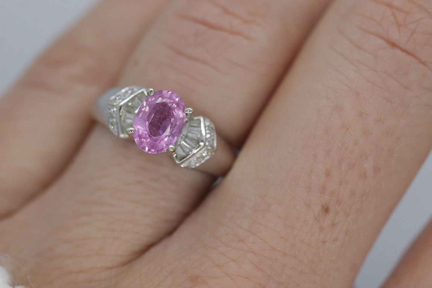 Oval Pink Sapphire Solitaire. 14k white gold with diamond melees st195