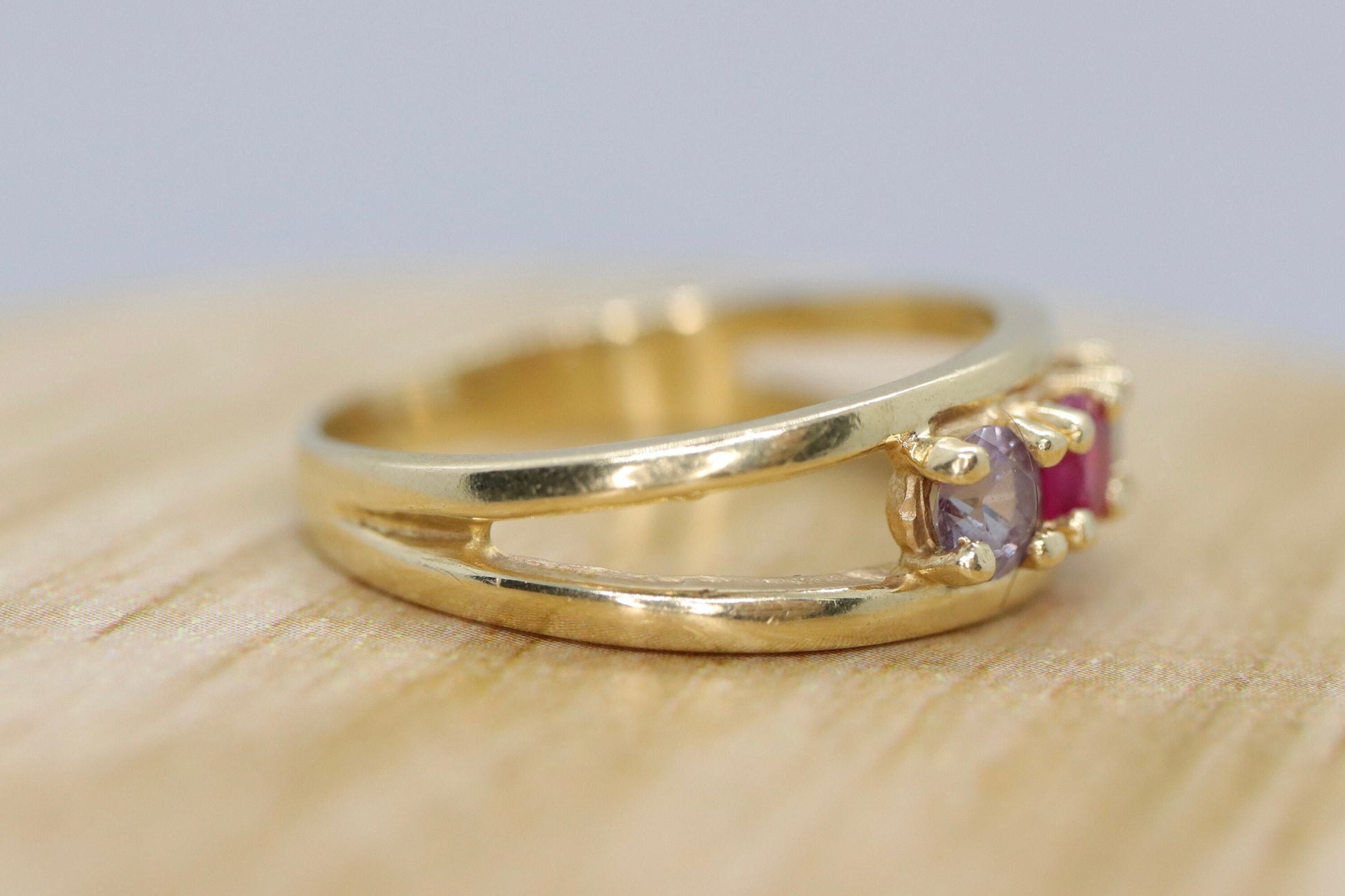 10k Yellow Gold  3 gemstone band. Ruby and Topaz band