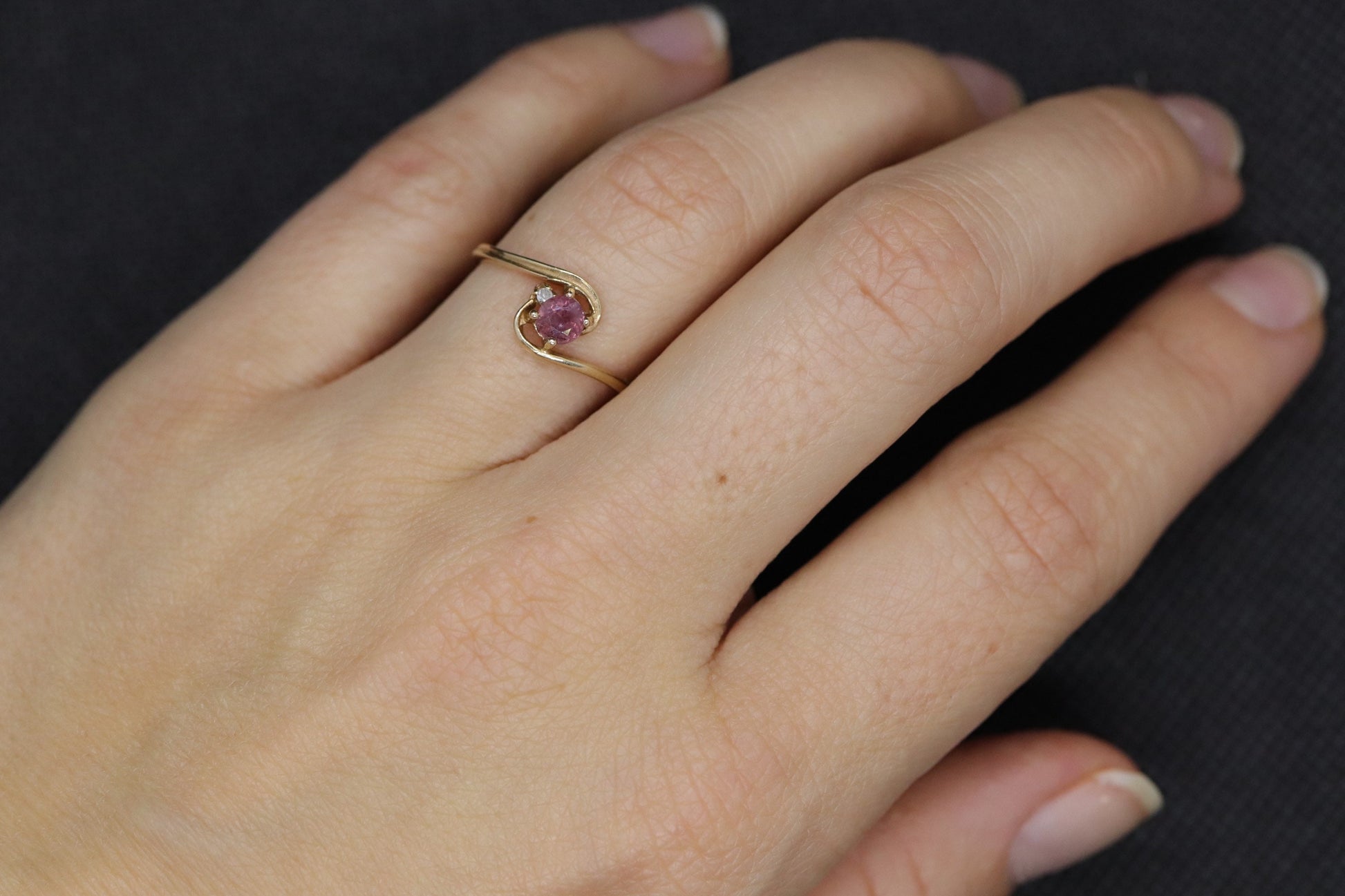 Dainty Ruby Ring. 10k round Ruby and Diamond Bypass ring