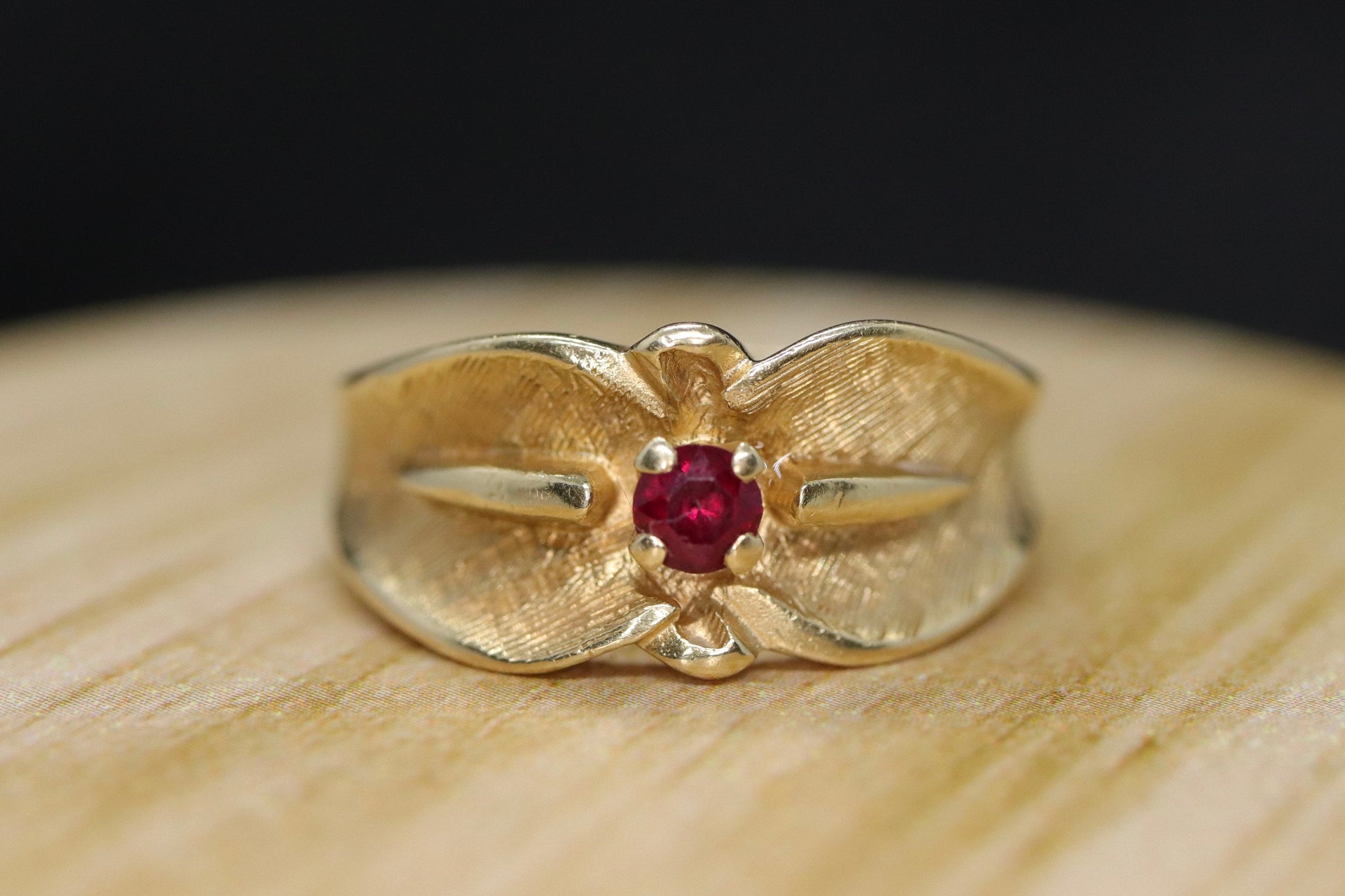 14k Ruby Ring. 14k round Ruby textured wide band