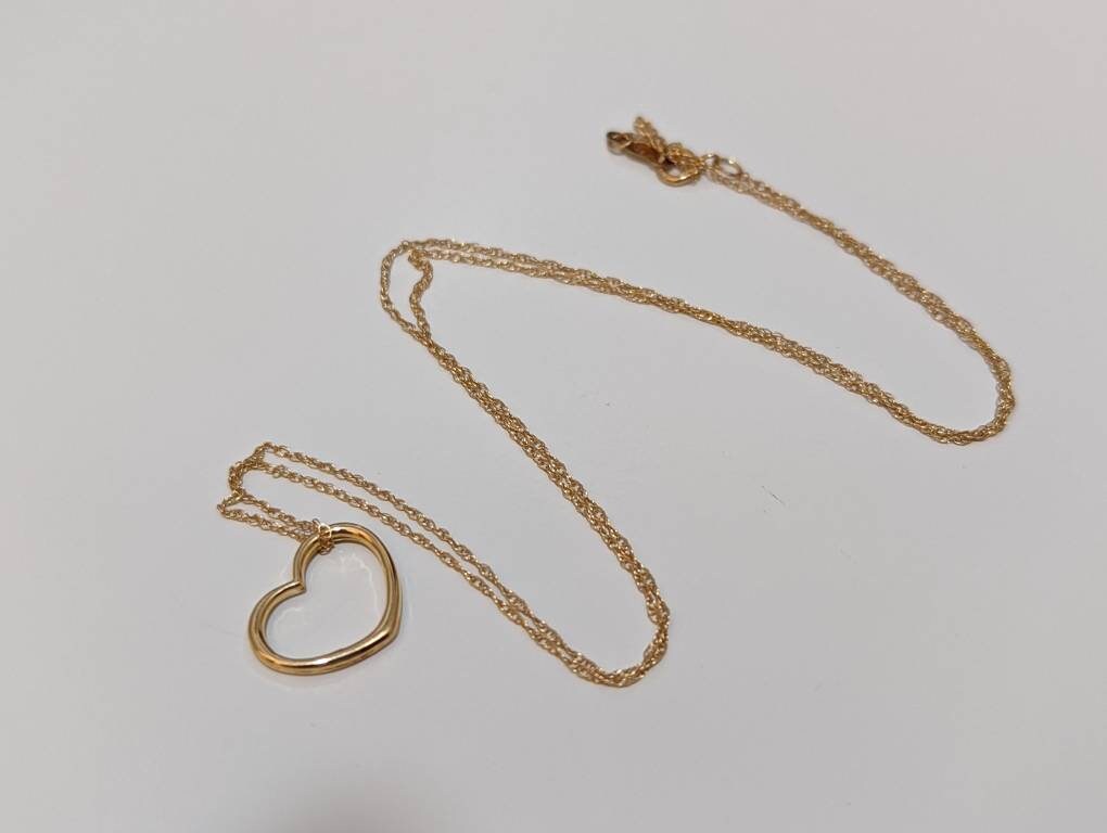 14k Open Heart Pendant. 14k Rope chain necklace. 1mm wide 18in length. Jacmel JCM