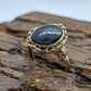 Oval Onyx ring. 10k ornate gold frame onyx ring. Mourning ring. St(103/50)