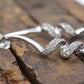 10k Diamond Earrings. Diamond Swirl Drop Dangle Earrings. 10k white gold. st(92/11)