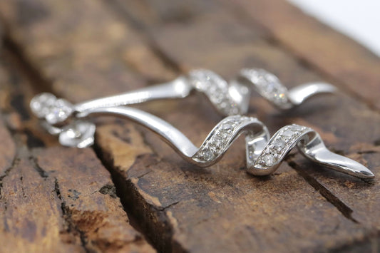 10k Diamond Earrings. Diamond Swirl Drop Dangle Earrings. 10k white gold. st(92/11)